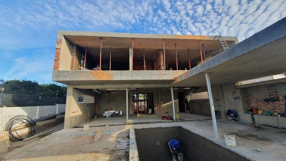 Double-storey concrete and brick structure under construction