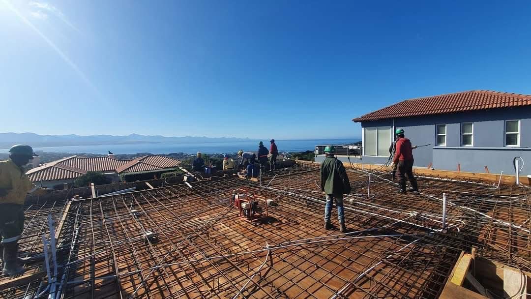 Concrete slab rebar work with sweeping Plettenberg Bay views