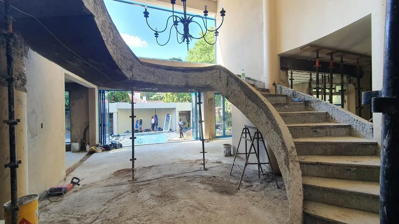 Sculpted concrete spiral staircase under construction
