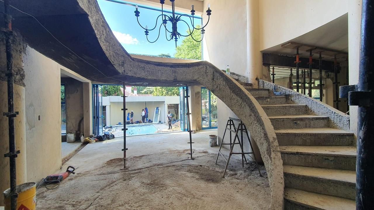 Sculpted concrete spiral staircase under construction